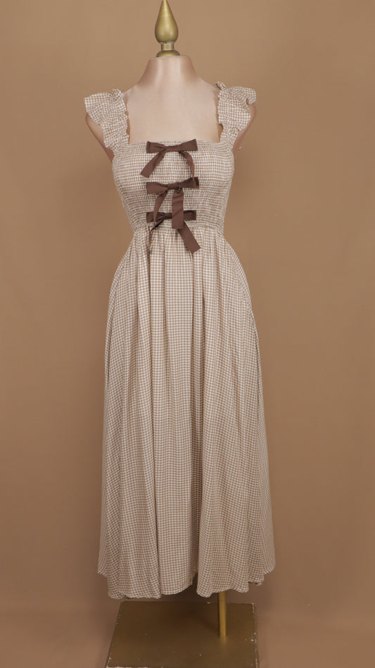 Vestido midi cuadricular con moños en busto