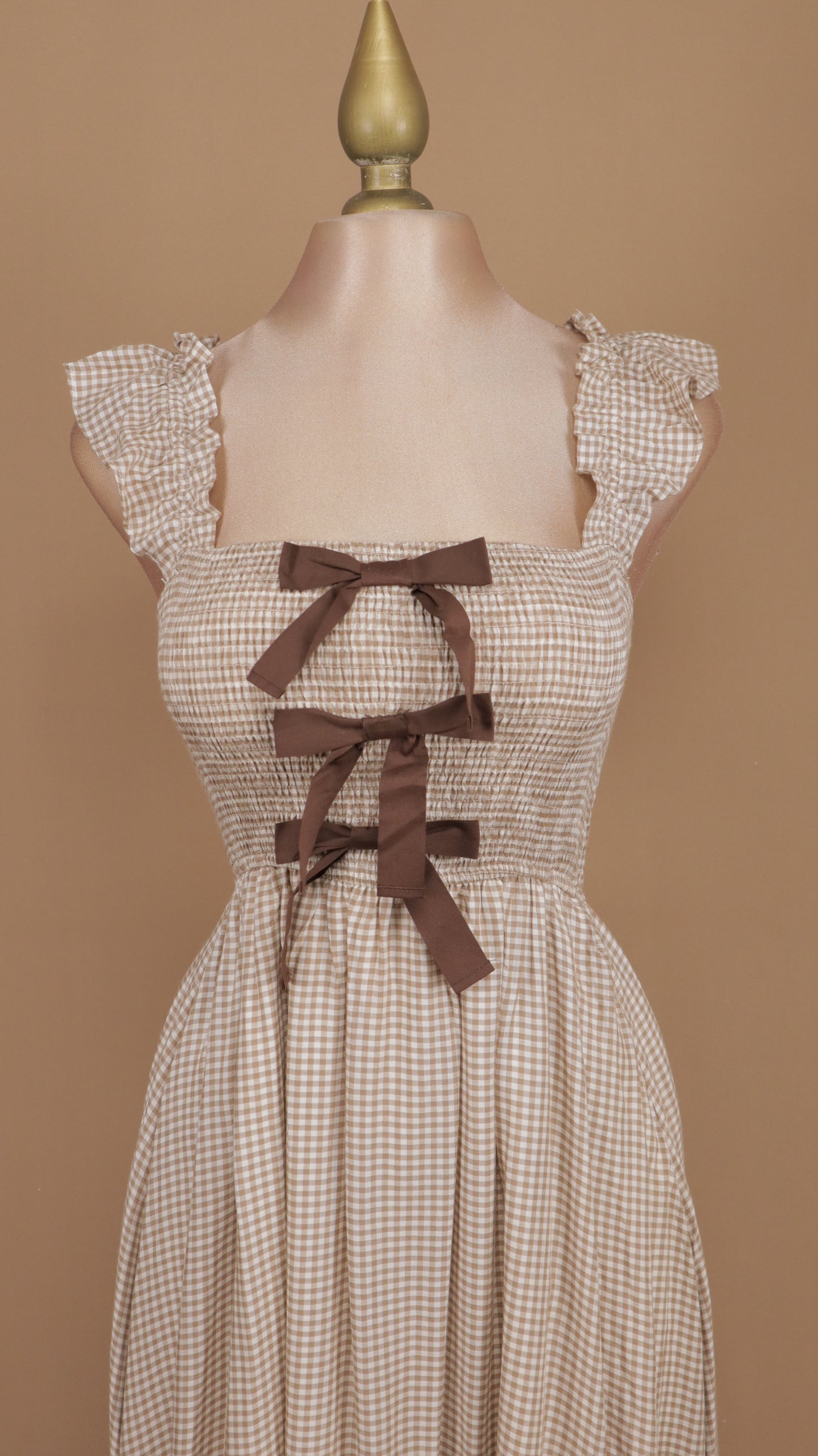 Vestido midi cuadricular con moños en busto