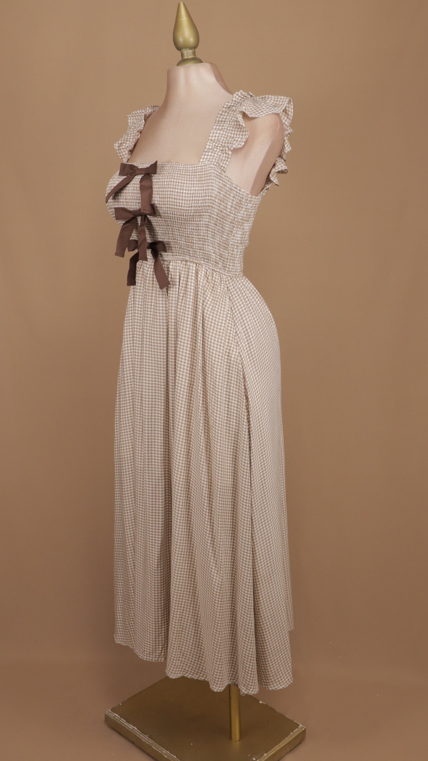 Vestido midi cuadricular con moños en busto