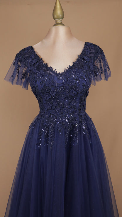 Vestido largo de tul con manga y aplicación