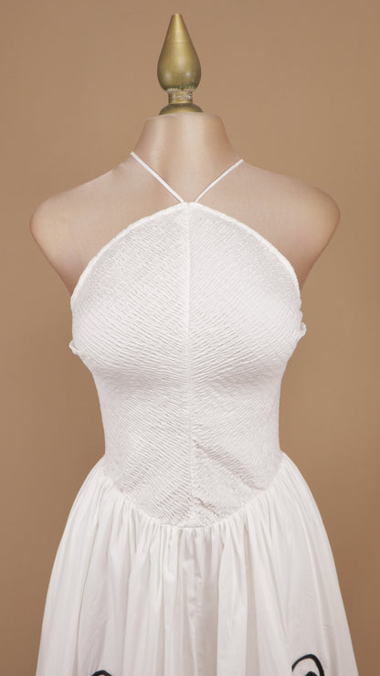 Vestido midi texturizado con cuello halter y bordado botánico lineal