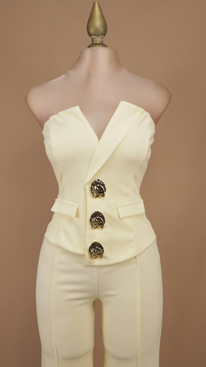 Palazzo sastrero strapless con top tipo chaleco y botones dorados