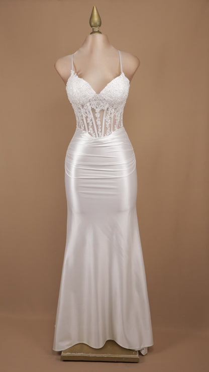 Vestido de novia corte sirena con corpiño de corsé transparente adornado y falda de satén
